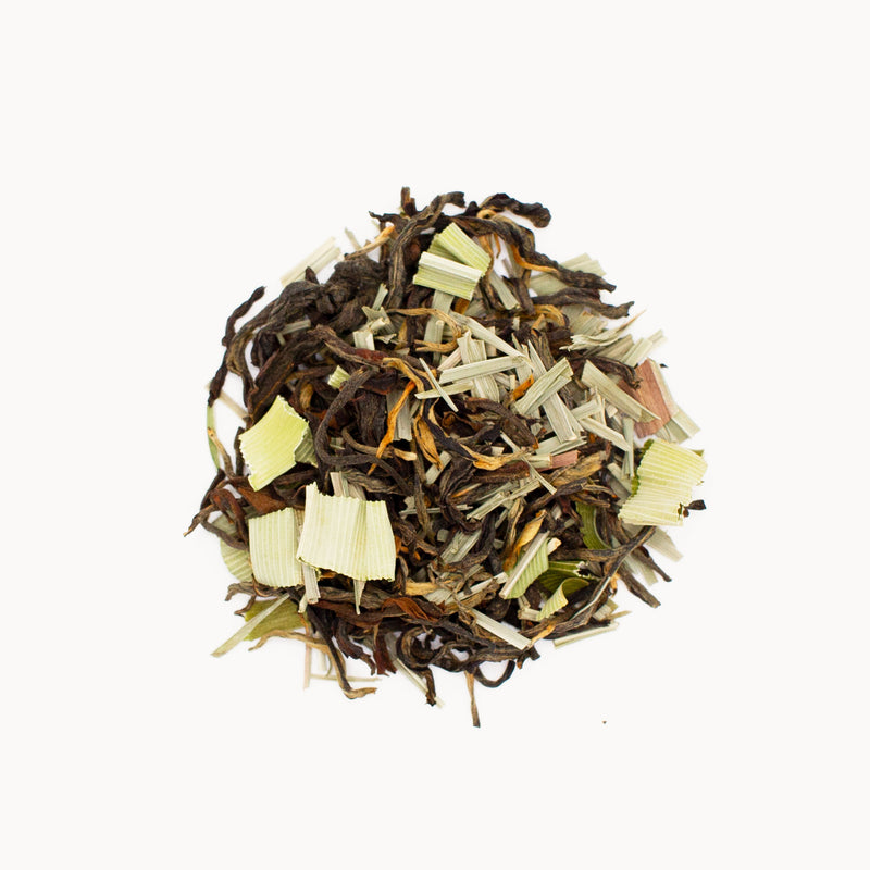 A pile of Pandan Red Tea leaves from ancient tea trees in Chiangrai Province on a white background, courtesy of Rishi Tea & Botanicals.