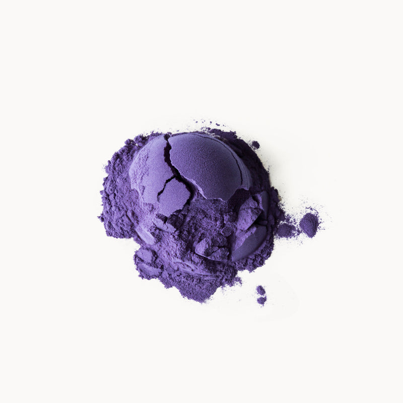 Butterfly Pea Flower Powder by Rishi Tea & Botanicals, a purple powder on a white background.
