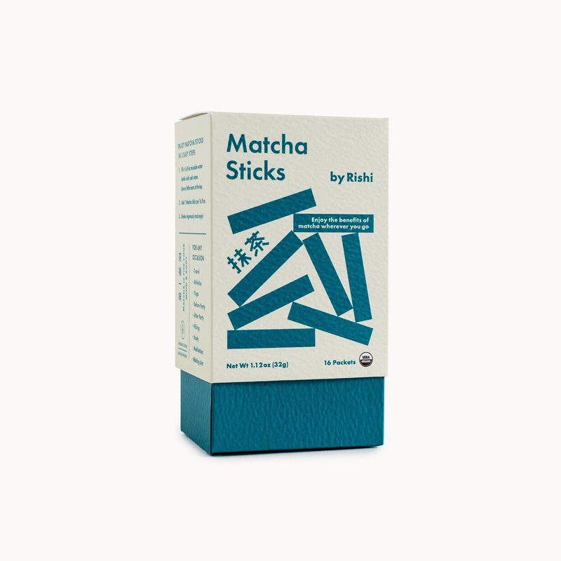 A box of Rishi Tea & Botanicals matcha sticks on a white background.
