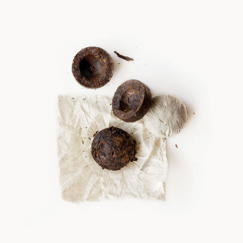 Pu’er Tuo Cha from Rishi Tea & Botanicals on a white background.
