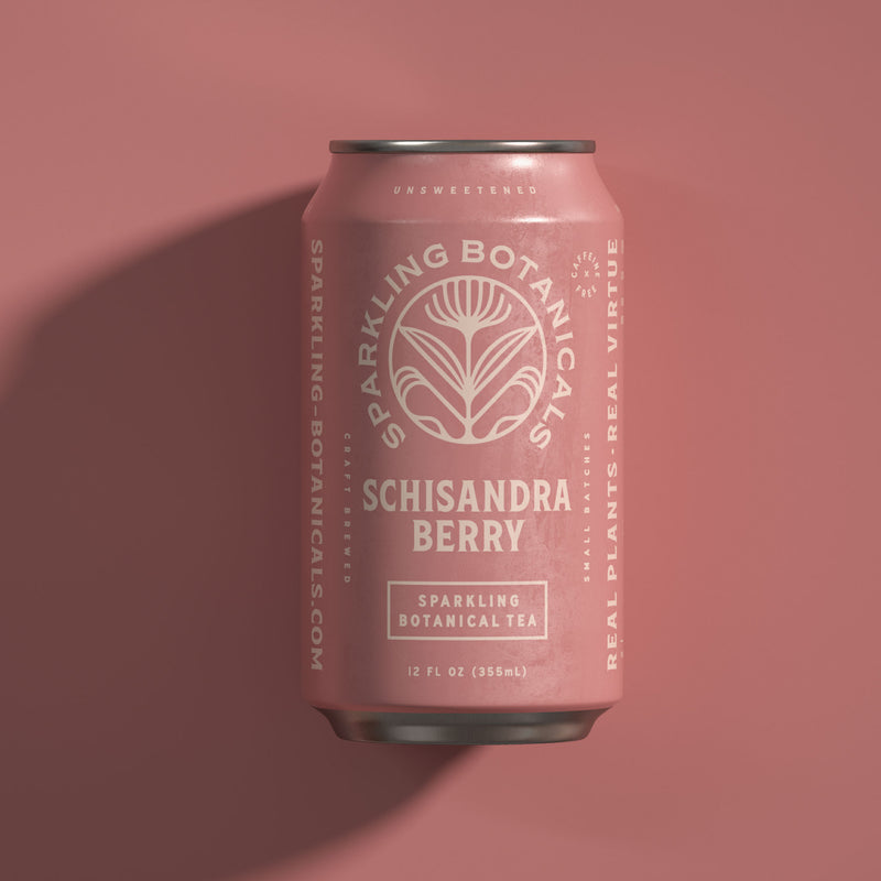 A can of Rishi Tea & Botanicals' Schisandra Berry on a pink background.