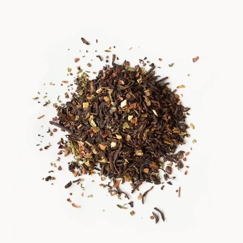 A pile of Rishi Tea & Botanicals Vanilla Mint Chai on a white background.